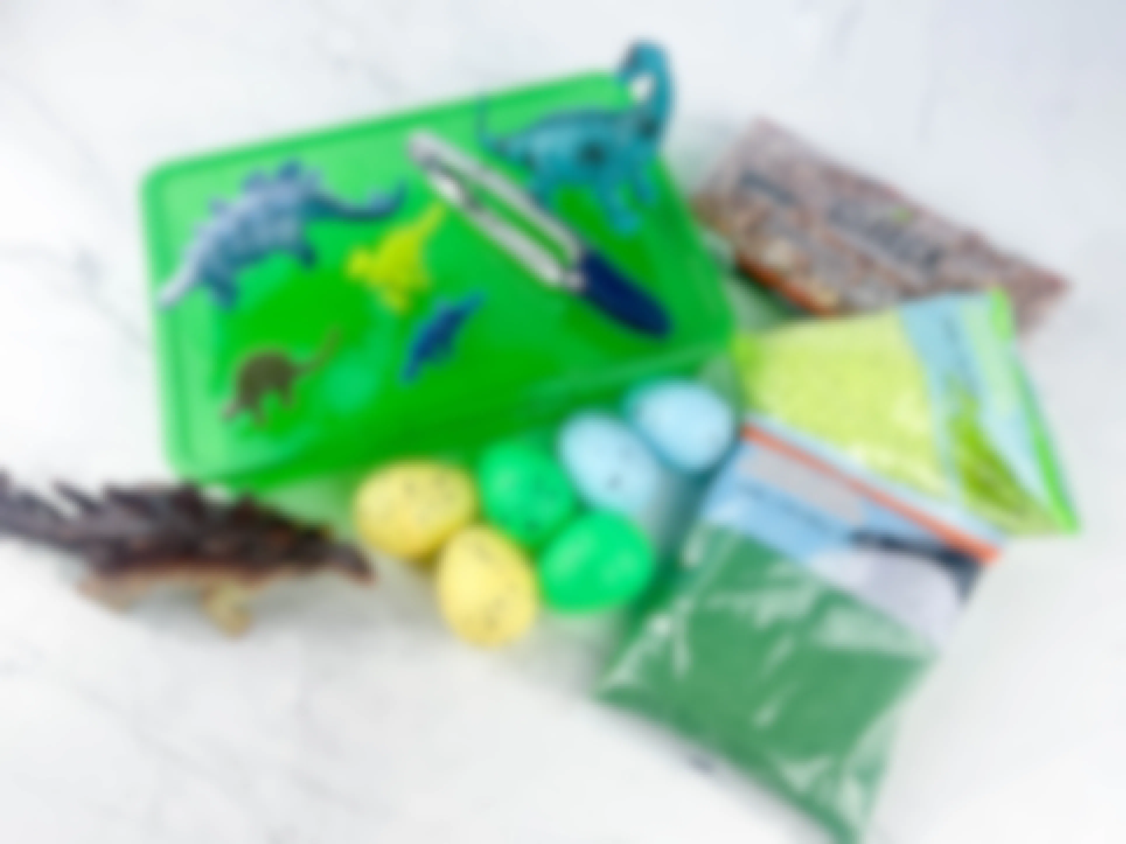 items to make a diy dinosaur sensory bin sitting on a counter