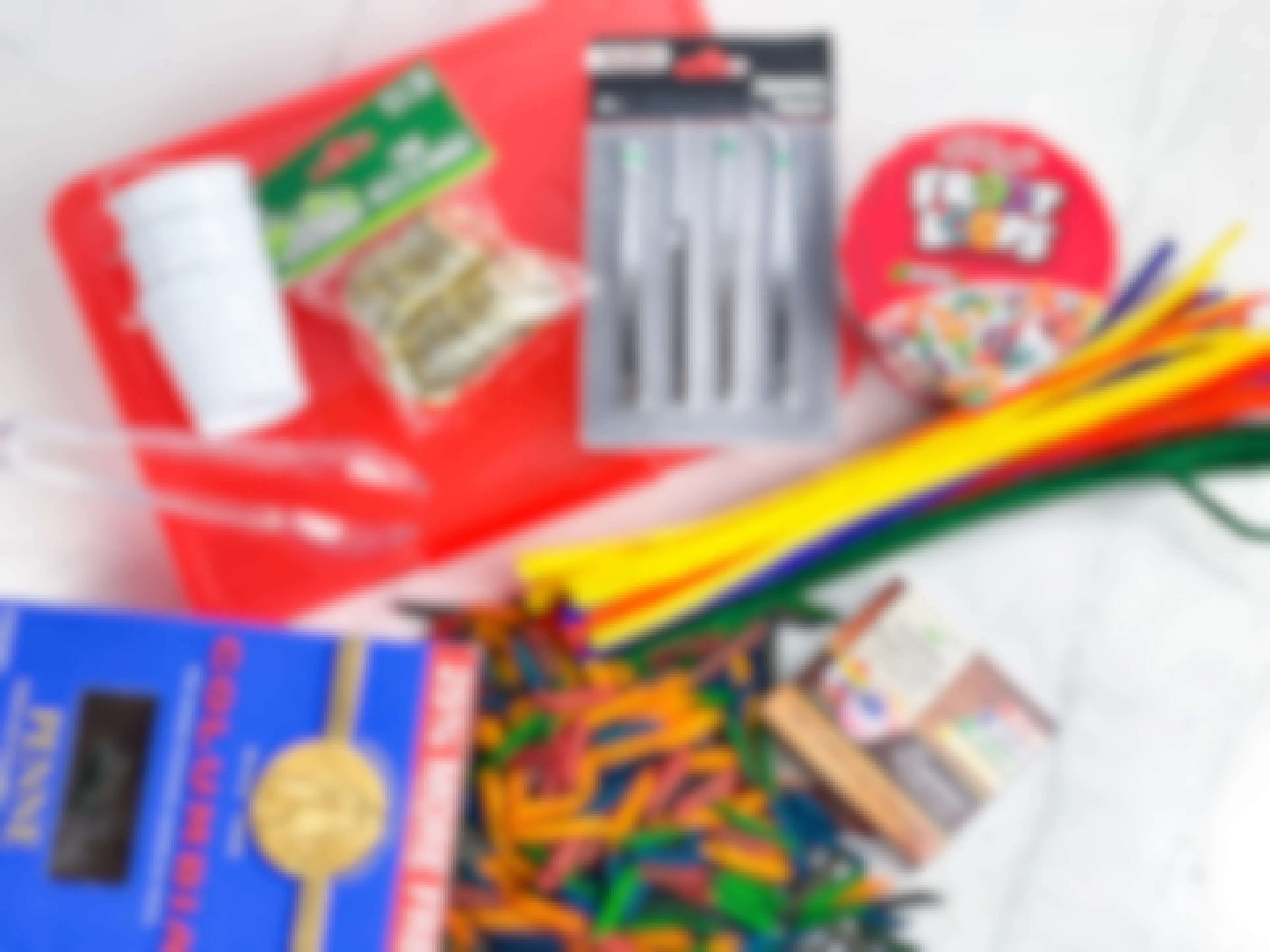 items to make a diy rainbow themed sensory bin sitting on a counter