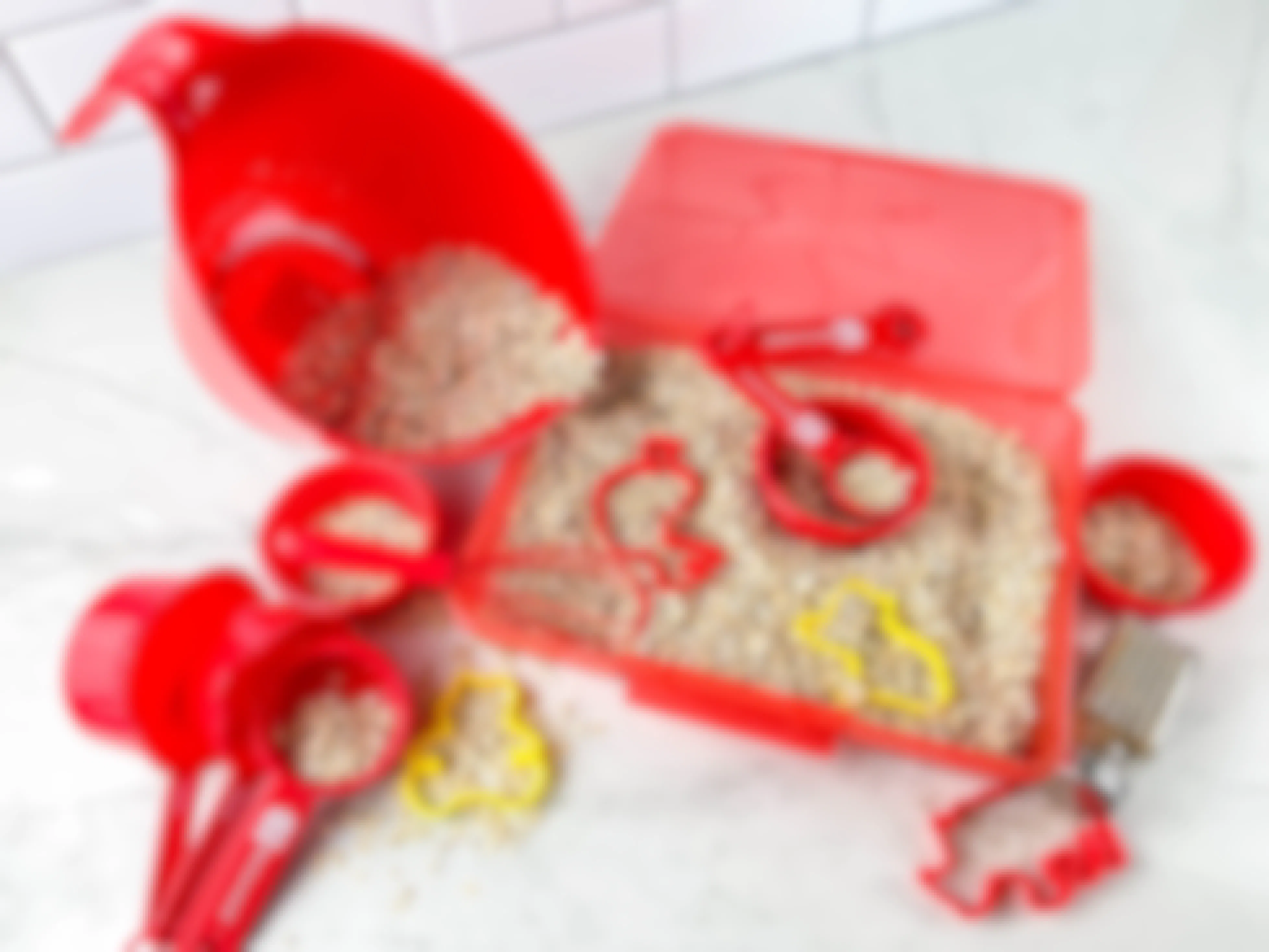 a diy oatmeal cookie themed sensory bin sitting on a counter