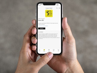 person looking at the dollar general app on their iphone
