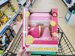 hand holding a kids stand mixer toy
