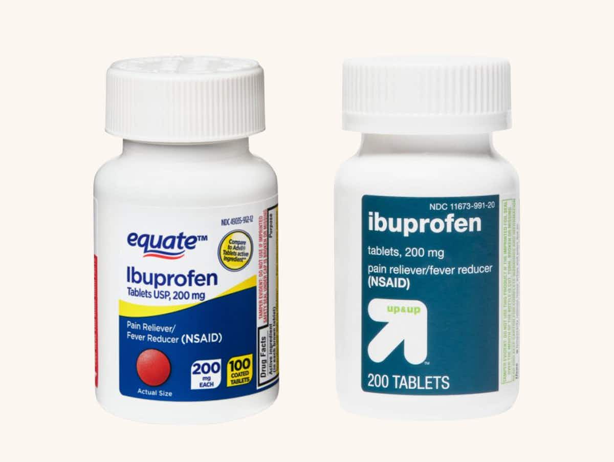A bottle of equate ibuprofen next to a bottle of up & up ibuprofen