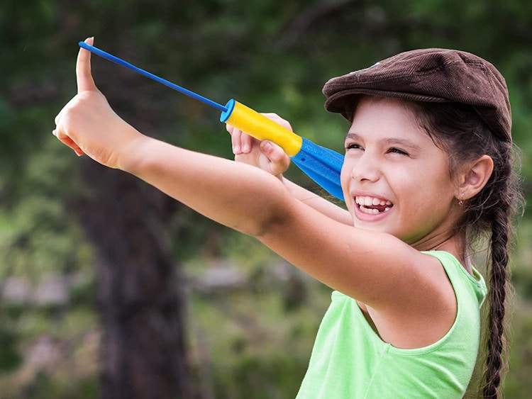 child shooting foam finger rocket