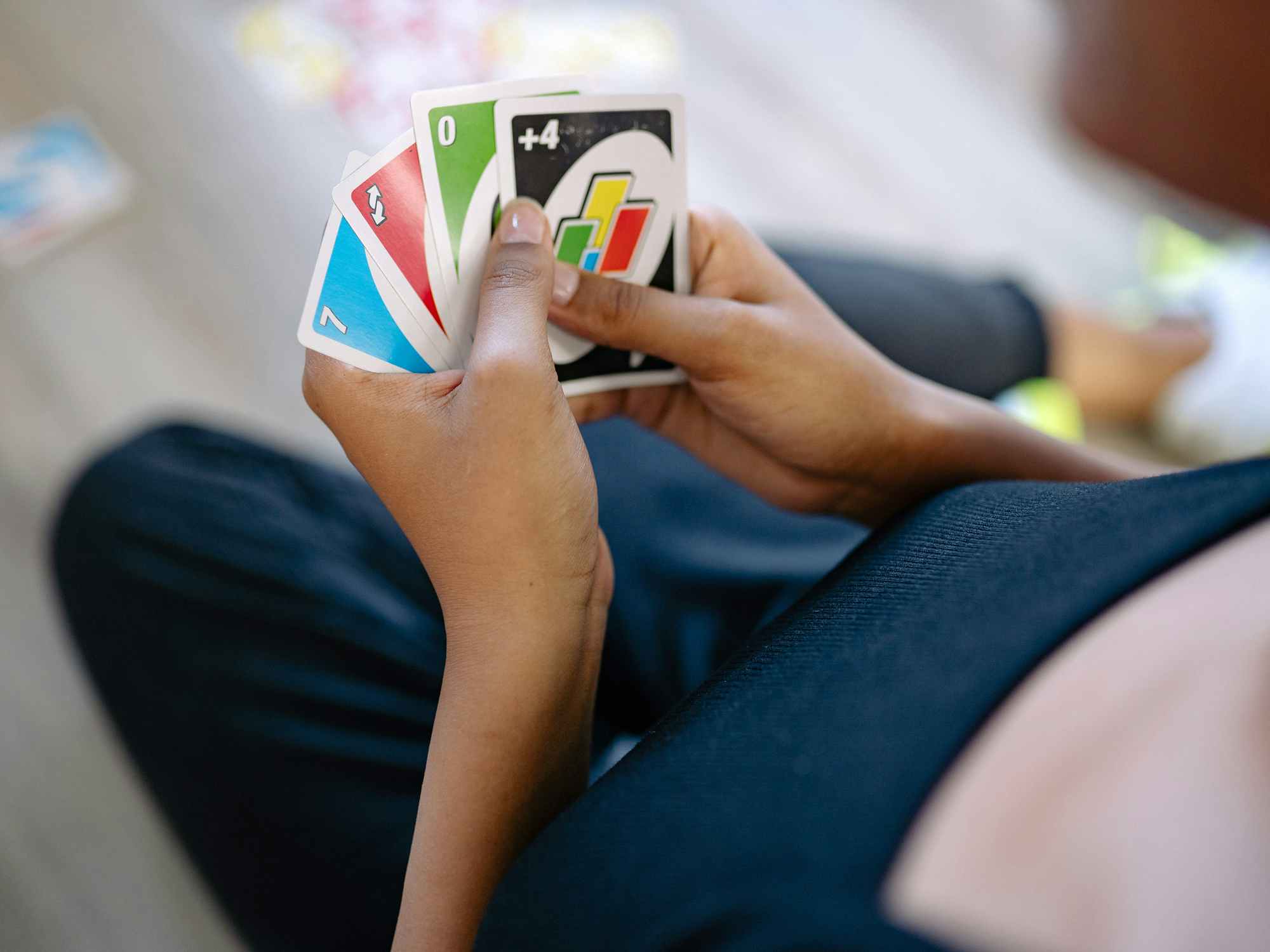 person playing uno card game