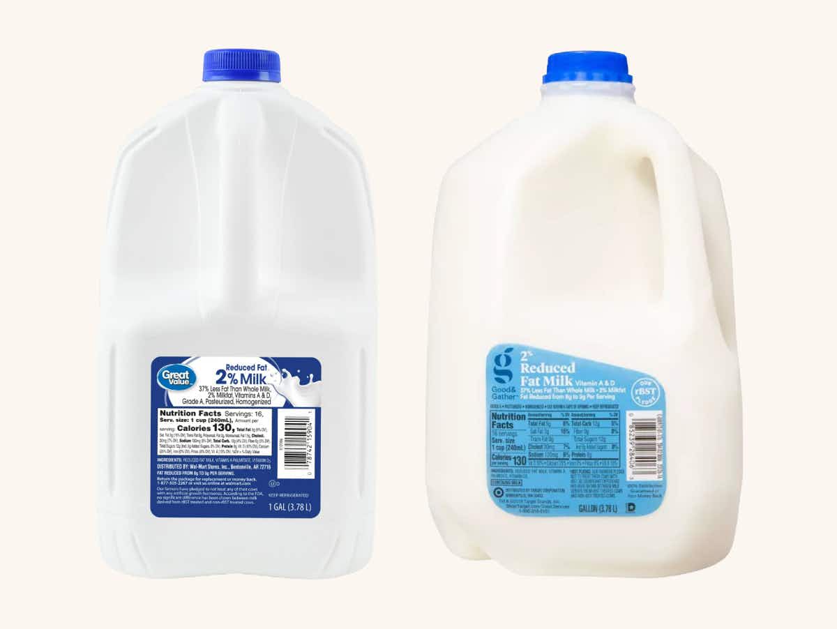 A gallon of great value 2% milk next to a gallon of good & gather 2% milk