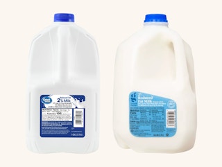A gallon of great value 2% milk next to a gallon of good & gather 2% milk