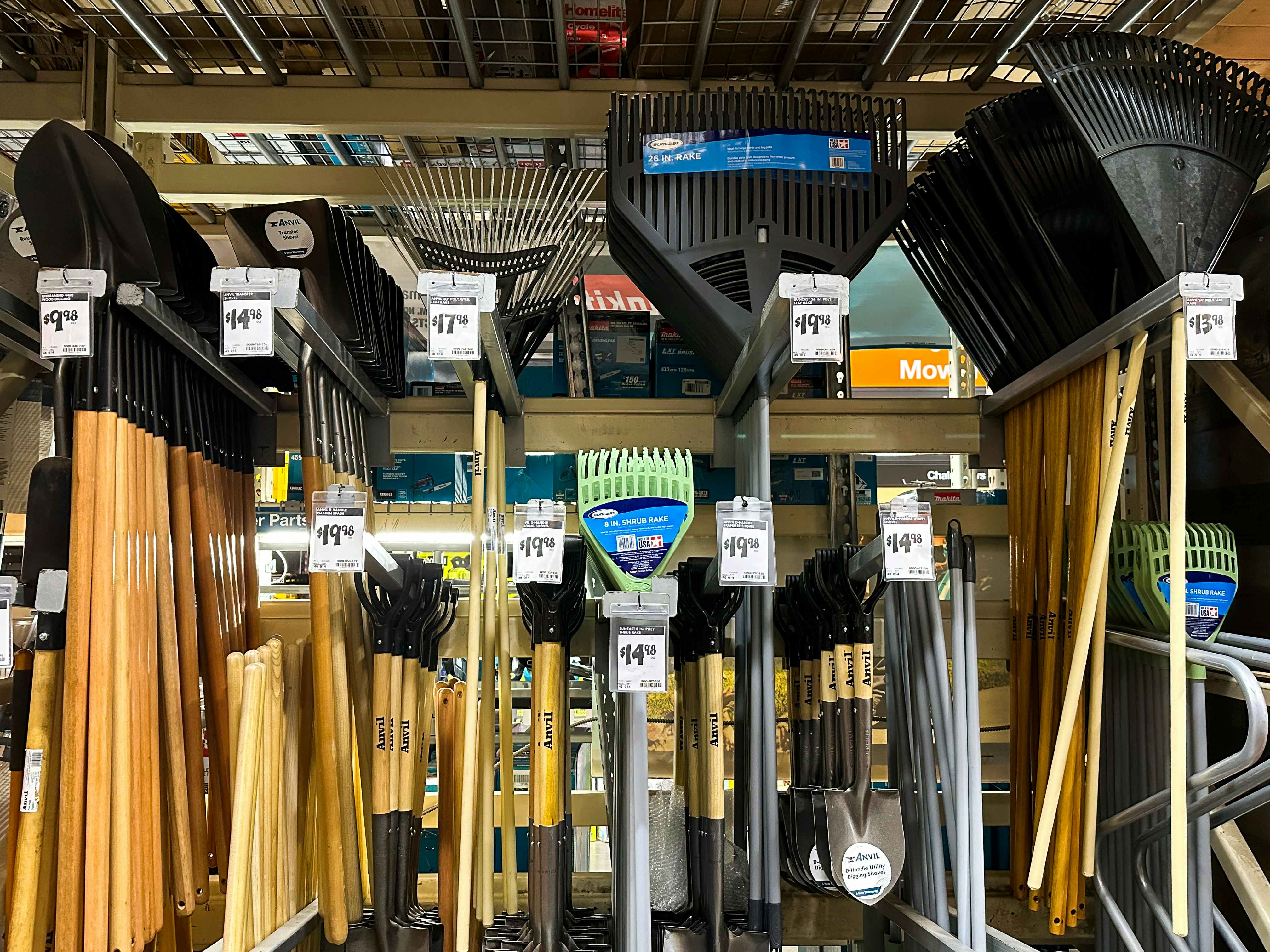 Rakes and shovels hanging up at Home Depot