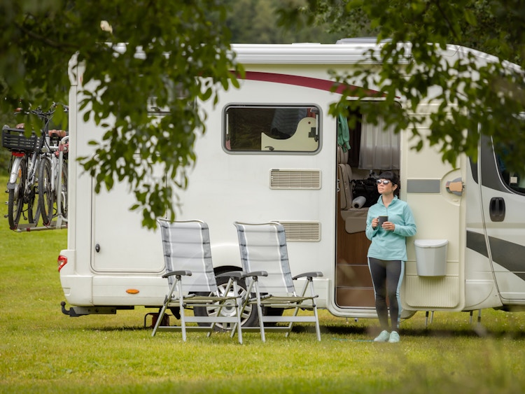 a person standing outside of their RV 