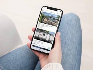 a person looking at outdoorsy on their iphone