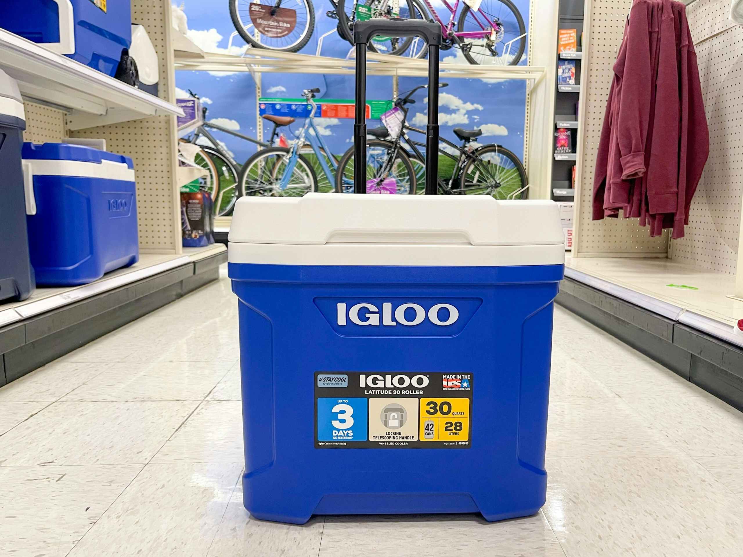 An Igloo cooler sitting in the middle of a store aisle.