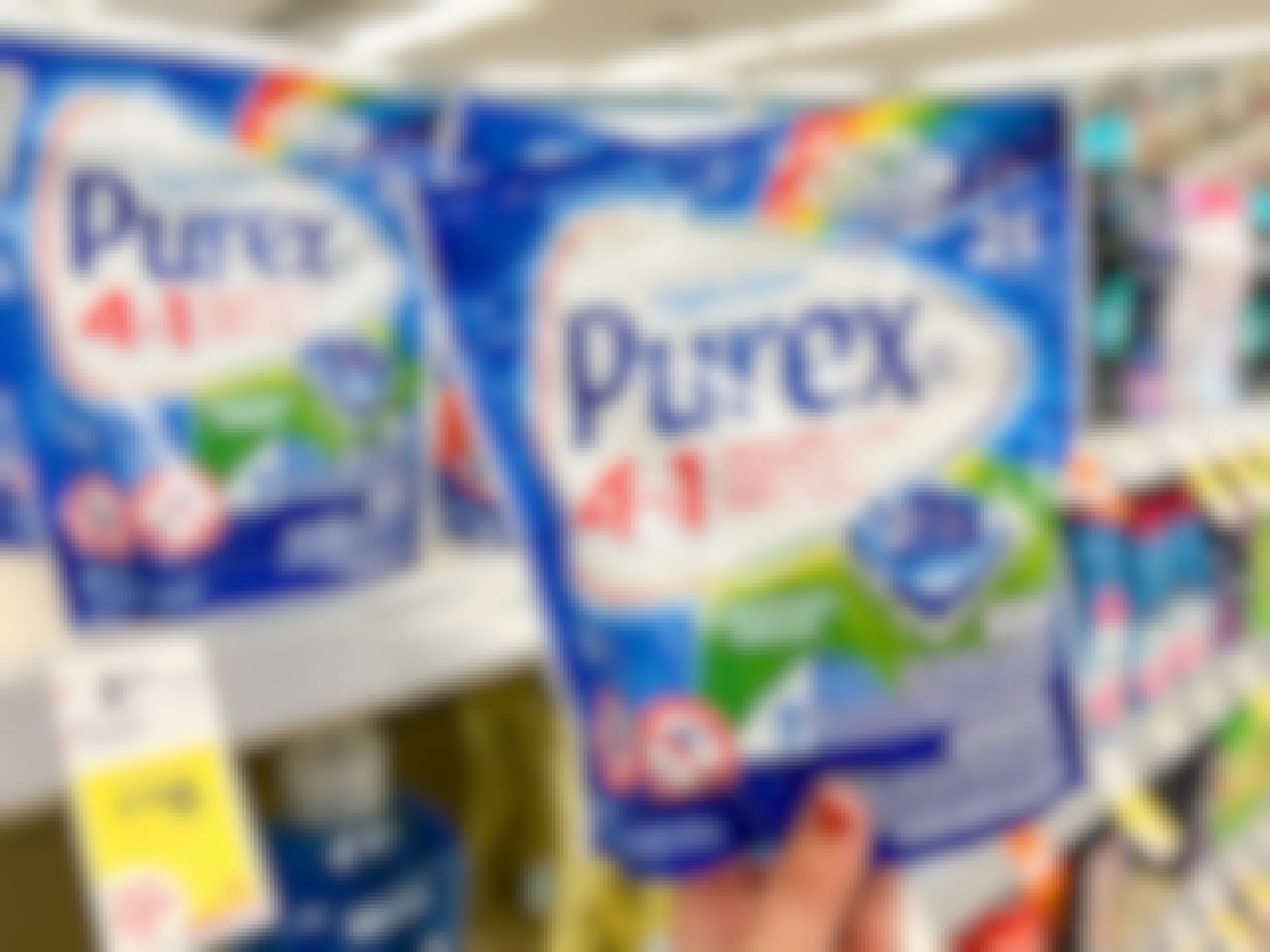 hand holding purex laundry pacs