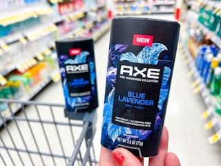 hand holding axe deodorant