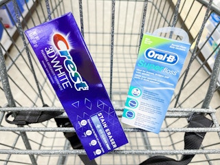 hand holding crest and oral-b products