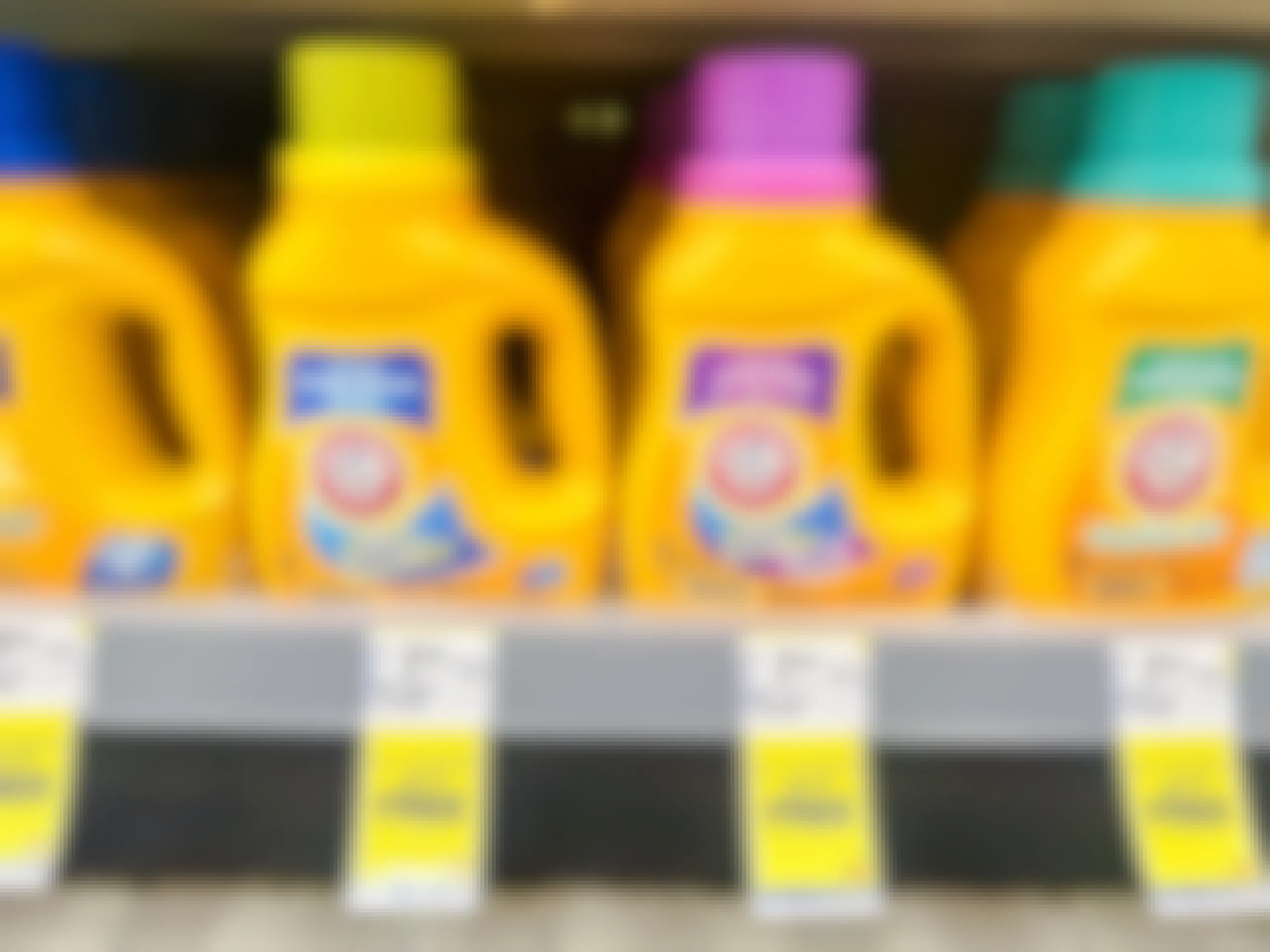 bottles of arm and hammer laundry detergent on shelf