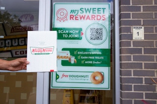 krispy kreme donuts box cookie themed sweet rewards hand 1682348230 1682348230