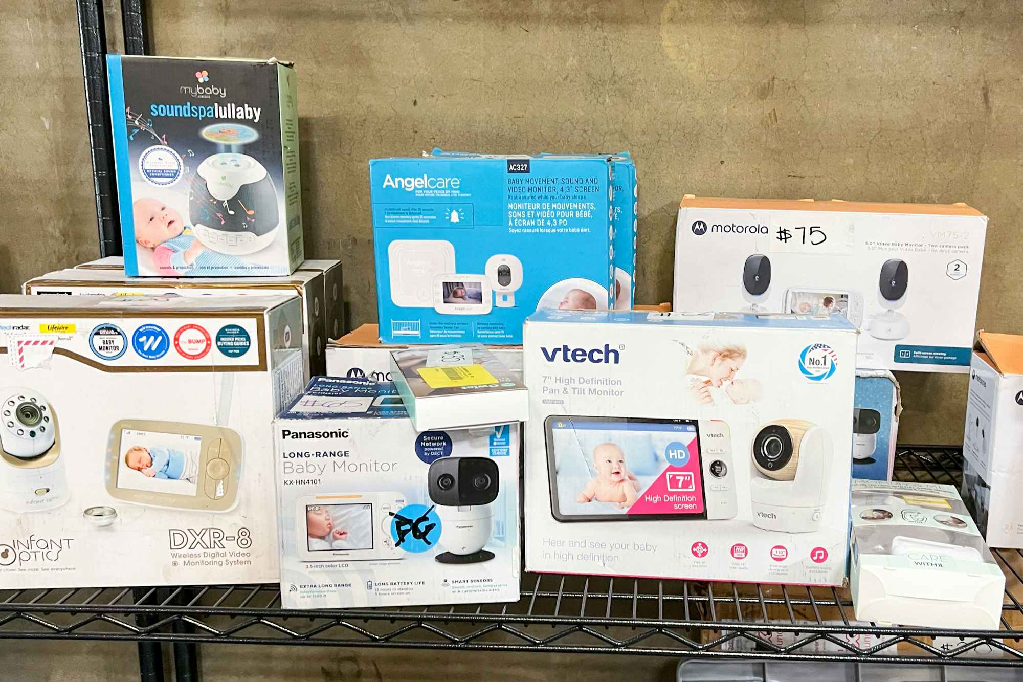 Some baby monitors and equipment for sale at a liquidation store