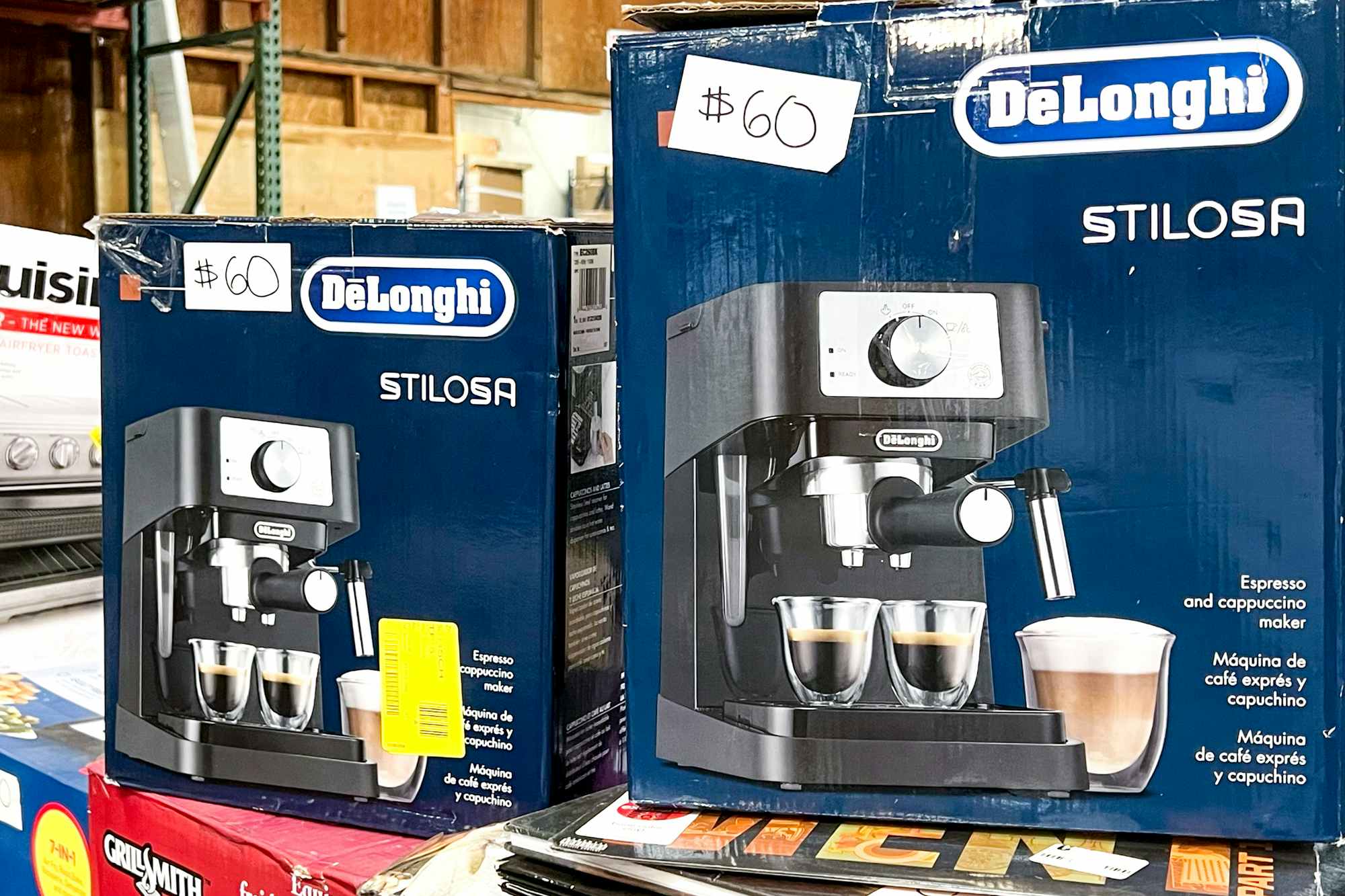 Some DeLonghi coffee makers for sale at a liquidation store