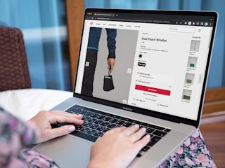 Someone shopping for the new Lululemon dual pouch wristlet on a laptop