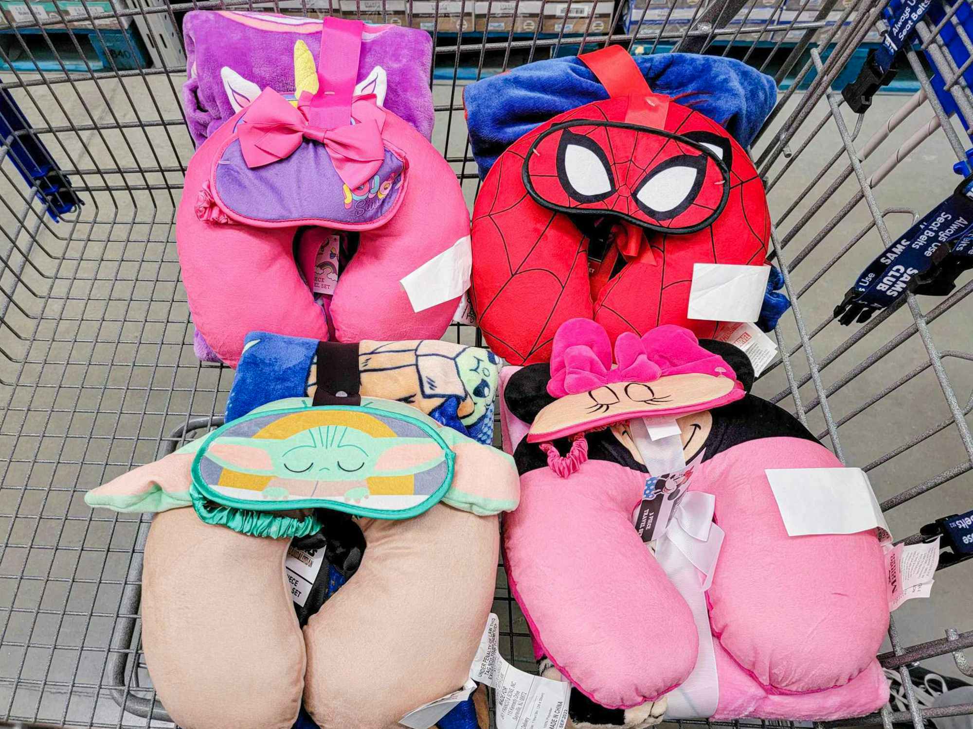 Disney neck pillow and blanket sets in a cart at Sam's Club