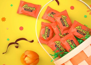 reeses chocolates spilling out of an easter basket