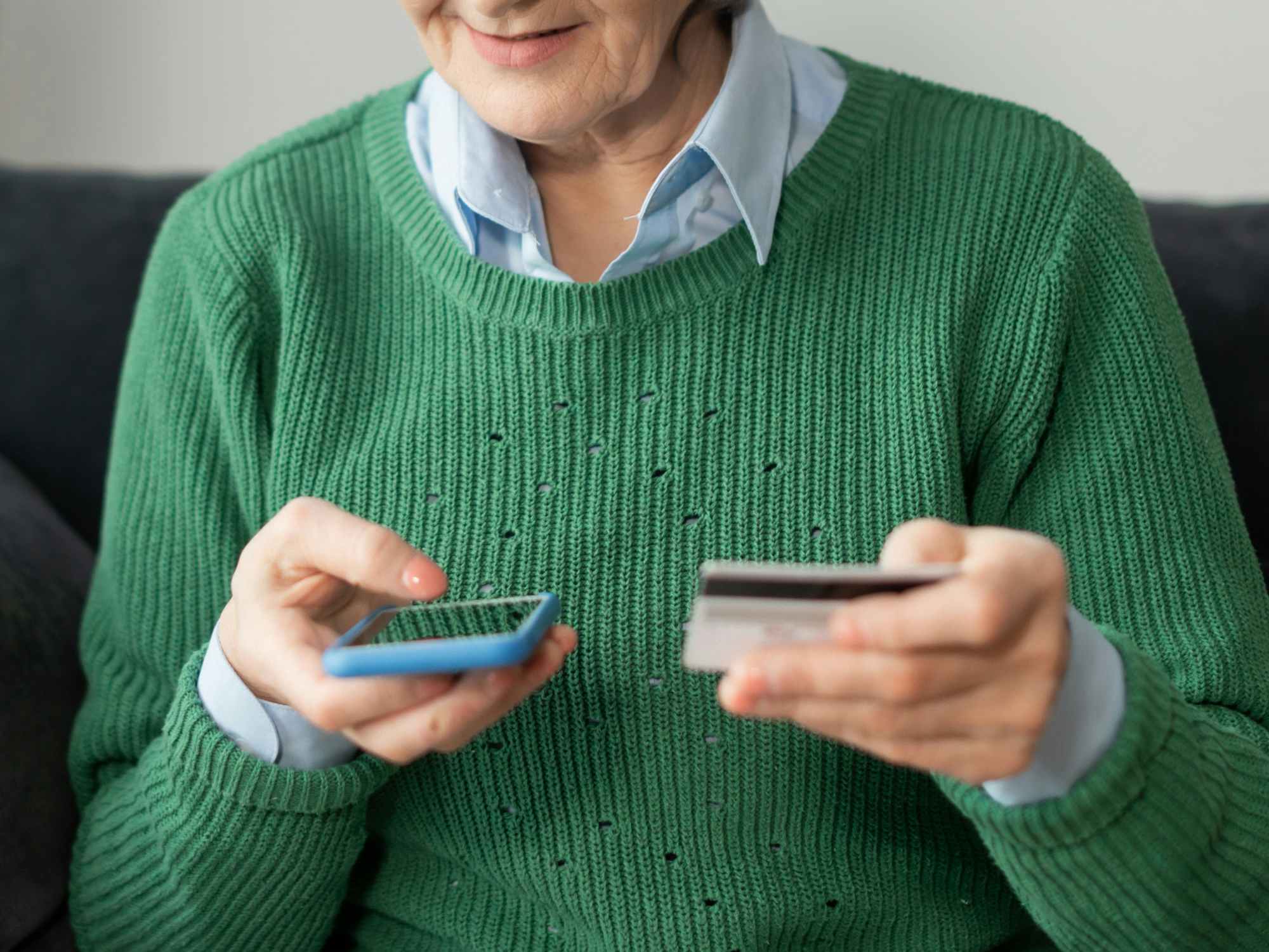 a person making a payment on their phone