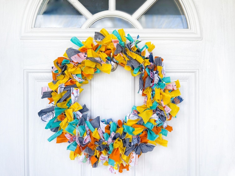 A rag wreath hanging on a door 