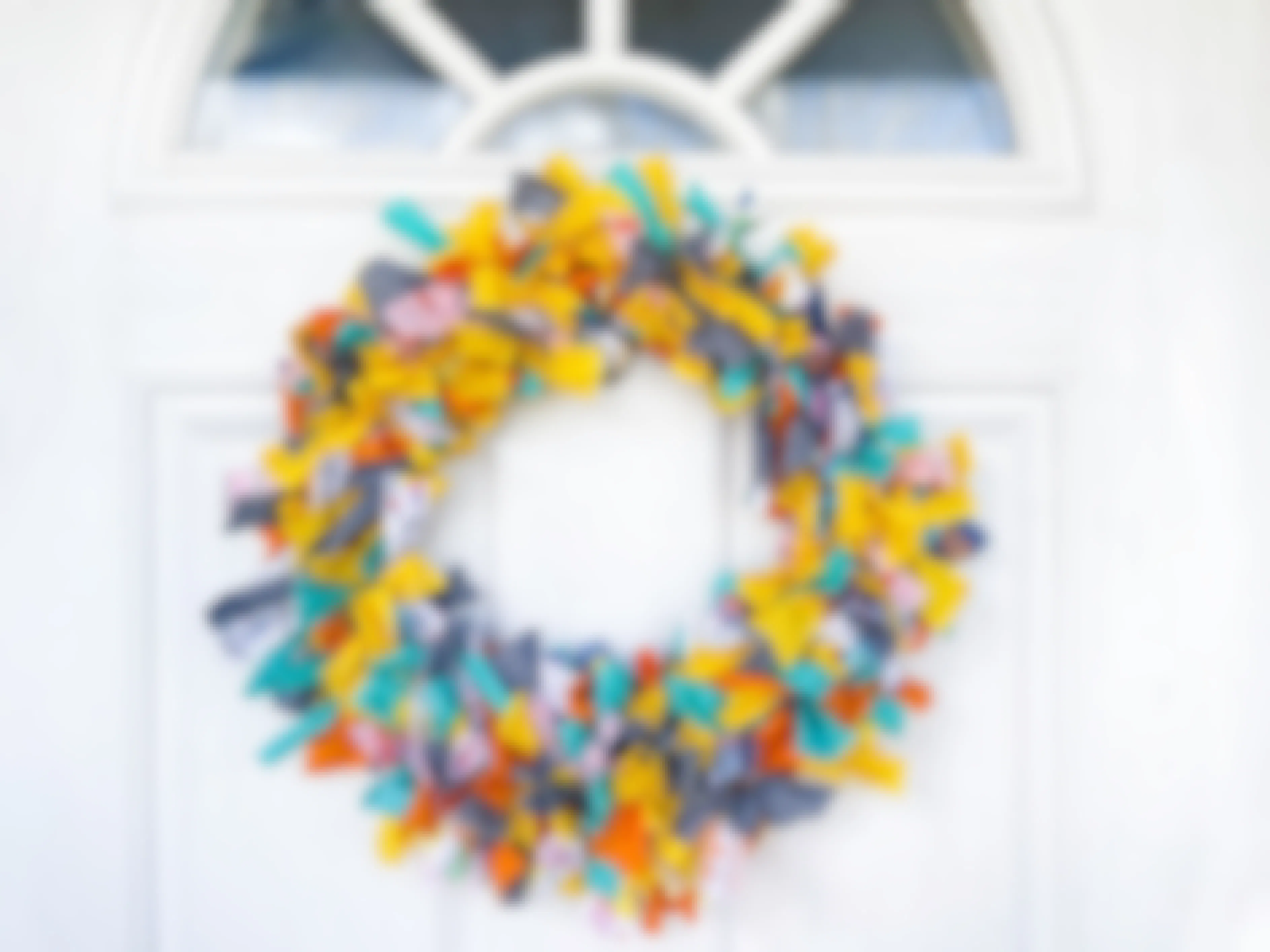 A rag wreath hanging on a door 