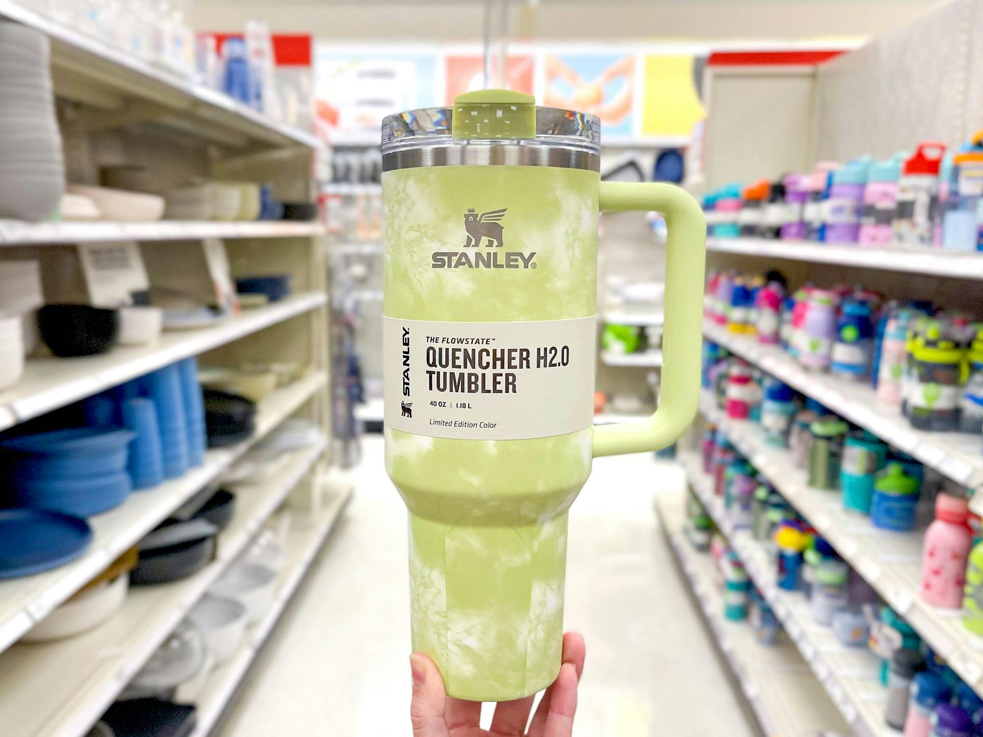 hand holding citron green tie-dye stanley quencher tumbler in target aisle