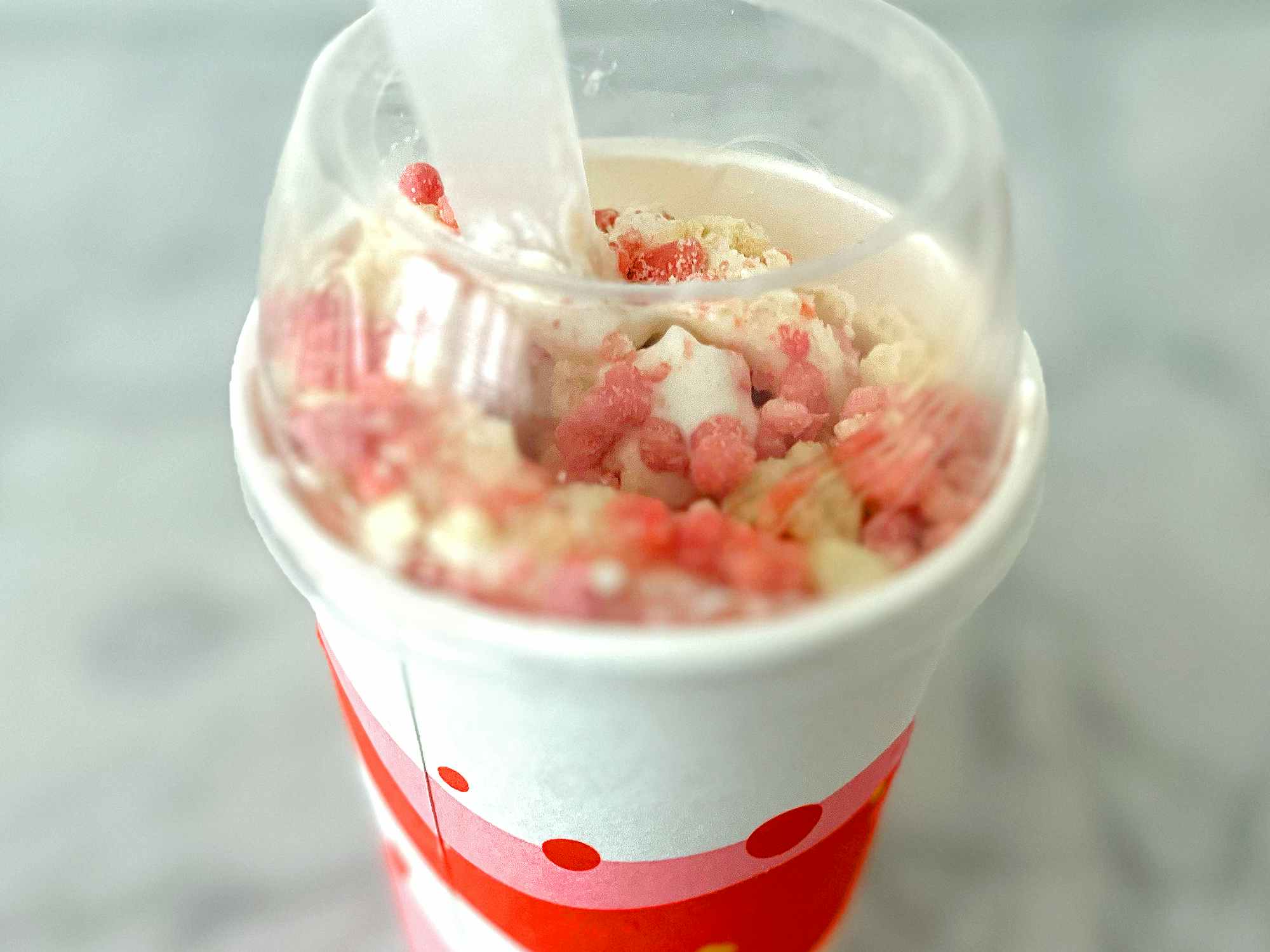limited-time mcdonalds strawberry shortcake mcflurry with toppings on table