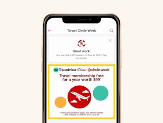 A smartphone showing the Target Circle Week offer for a free one-year membership to TripAdvisor Plus