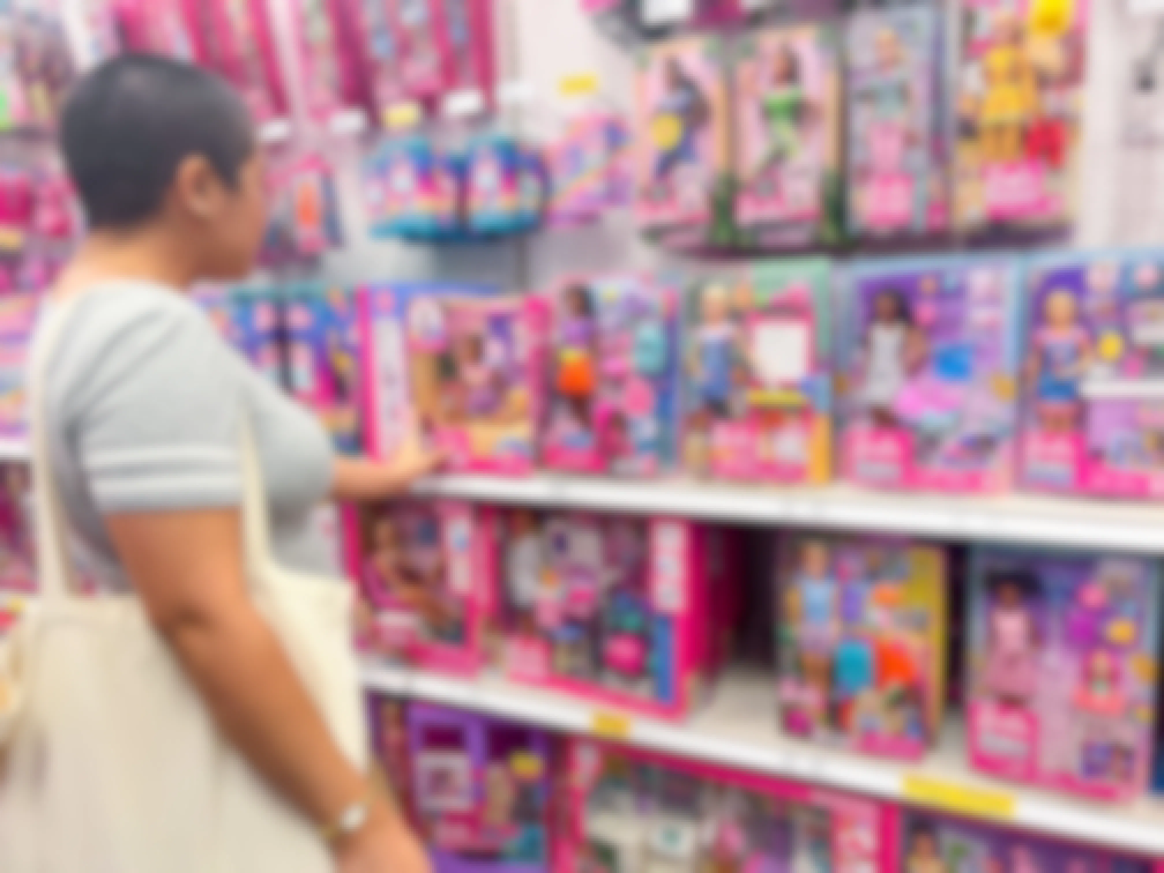 Person looking at barbie toys at Target
