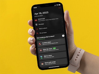 person holding an iphone with the target app return showing drive-up options