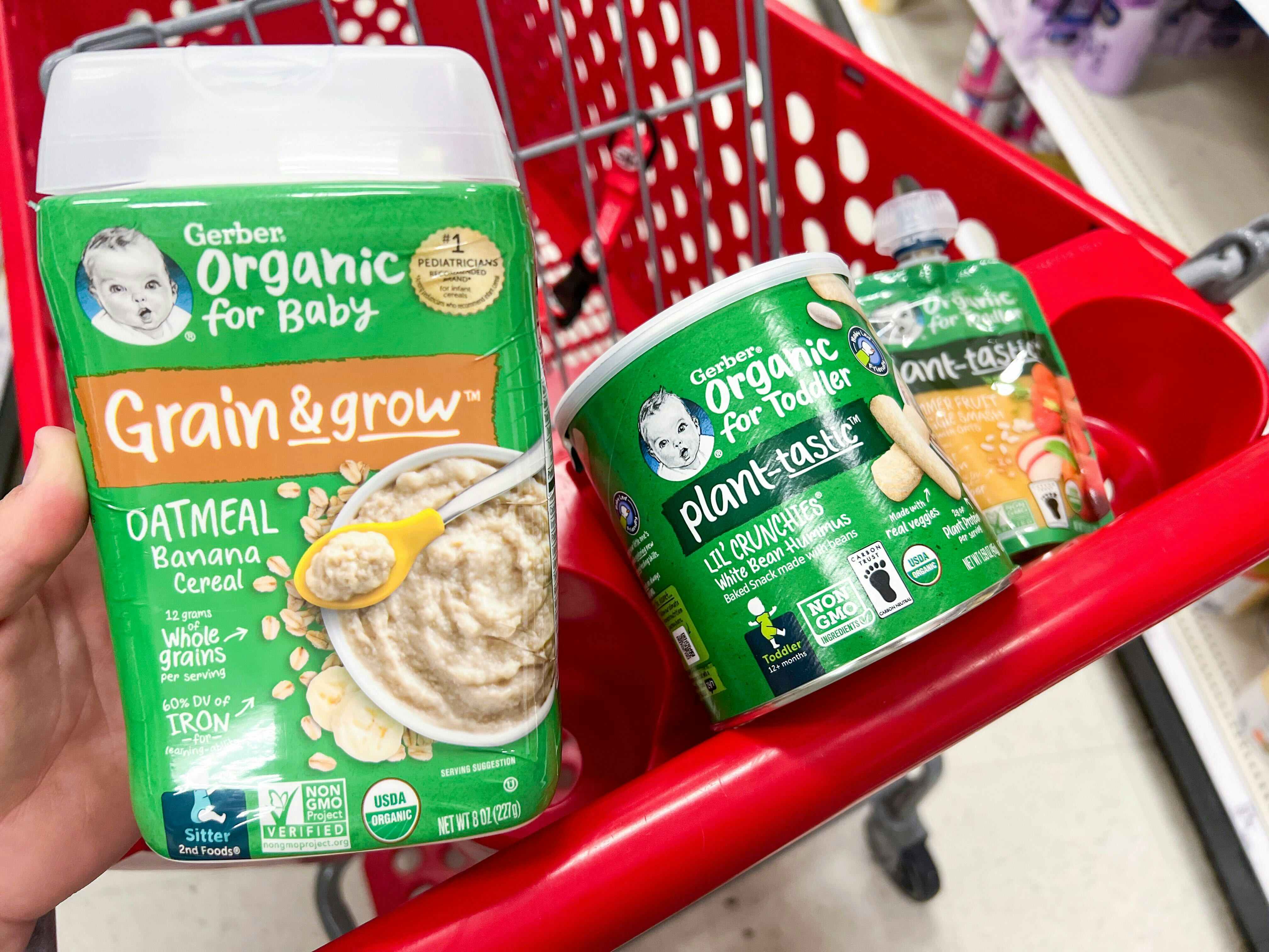 Three gerber organic baby products in the top section of a target shopping cart