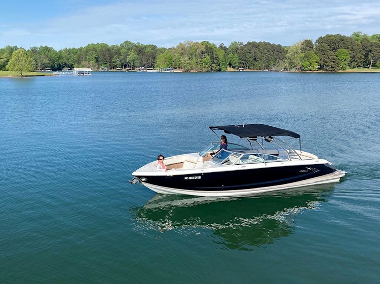 people on a boat in a lake