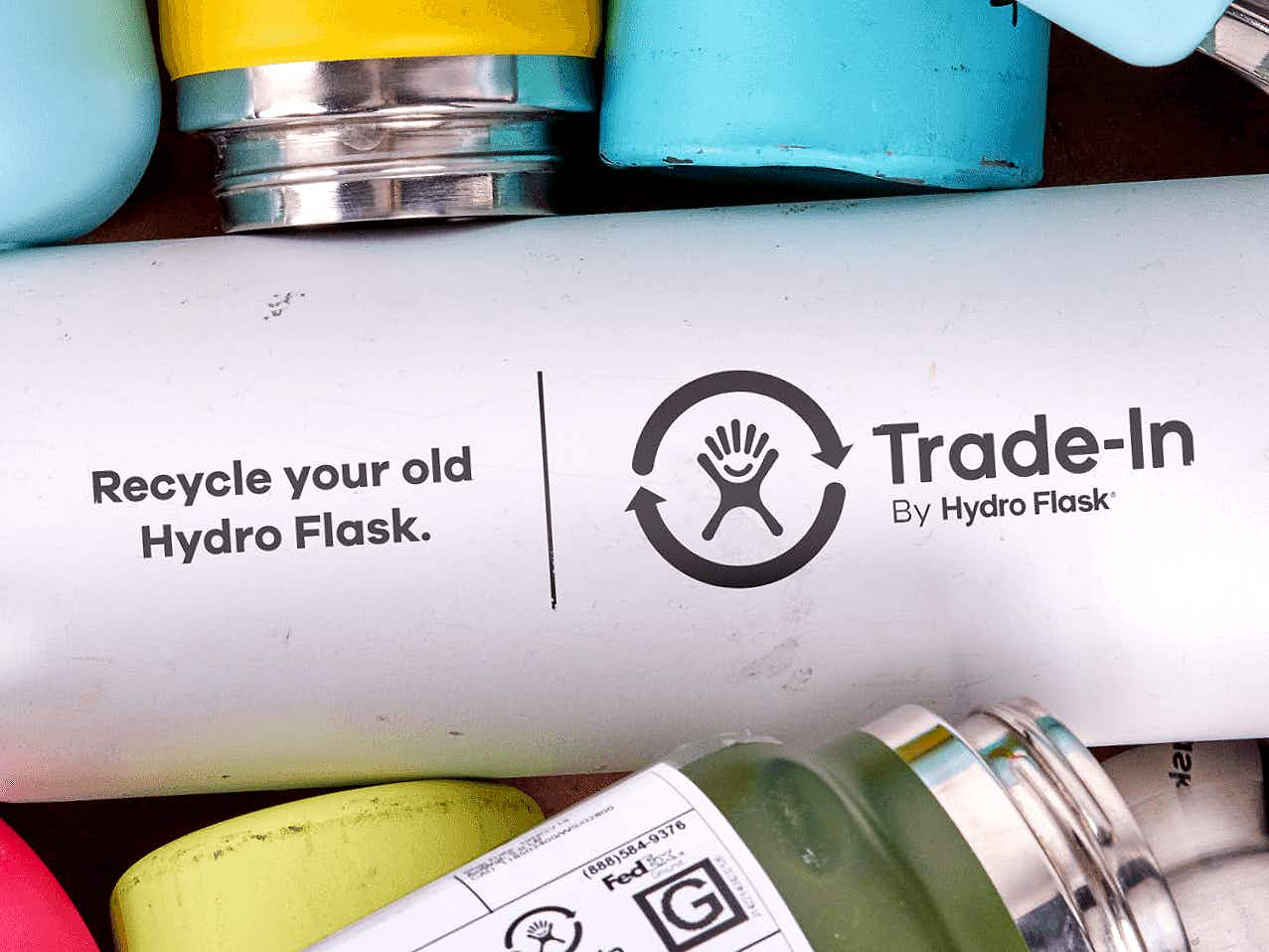 hydro flask recycling trade-in program details on pile of bottles