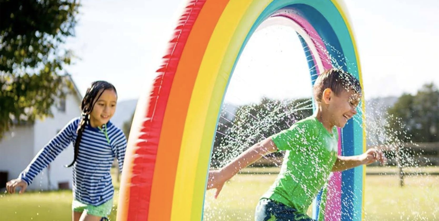 until gone Large Inflatable Rainbow Arch Sprinkler stock image 2023
