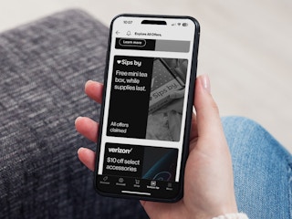 Someone holding a phone showing the Verizon Up offer that has had all offers claimed