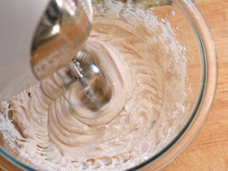 mixing violife vegan cream cheese fruit dip in bowl