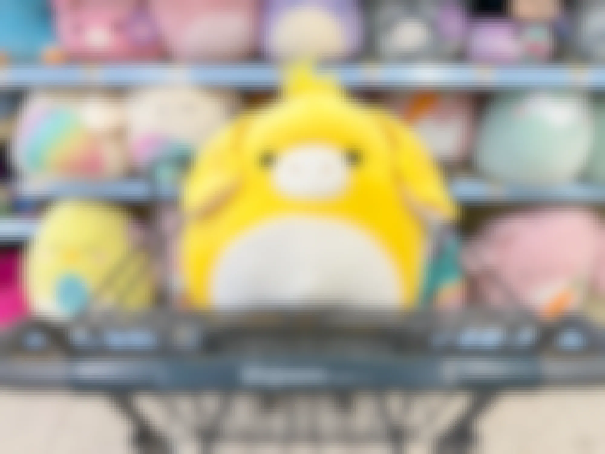 A Gavyn Squishmallow in a Walgreens cart