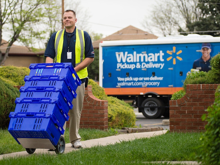 walmart delivery person bringing groceries to front door