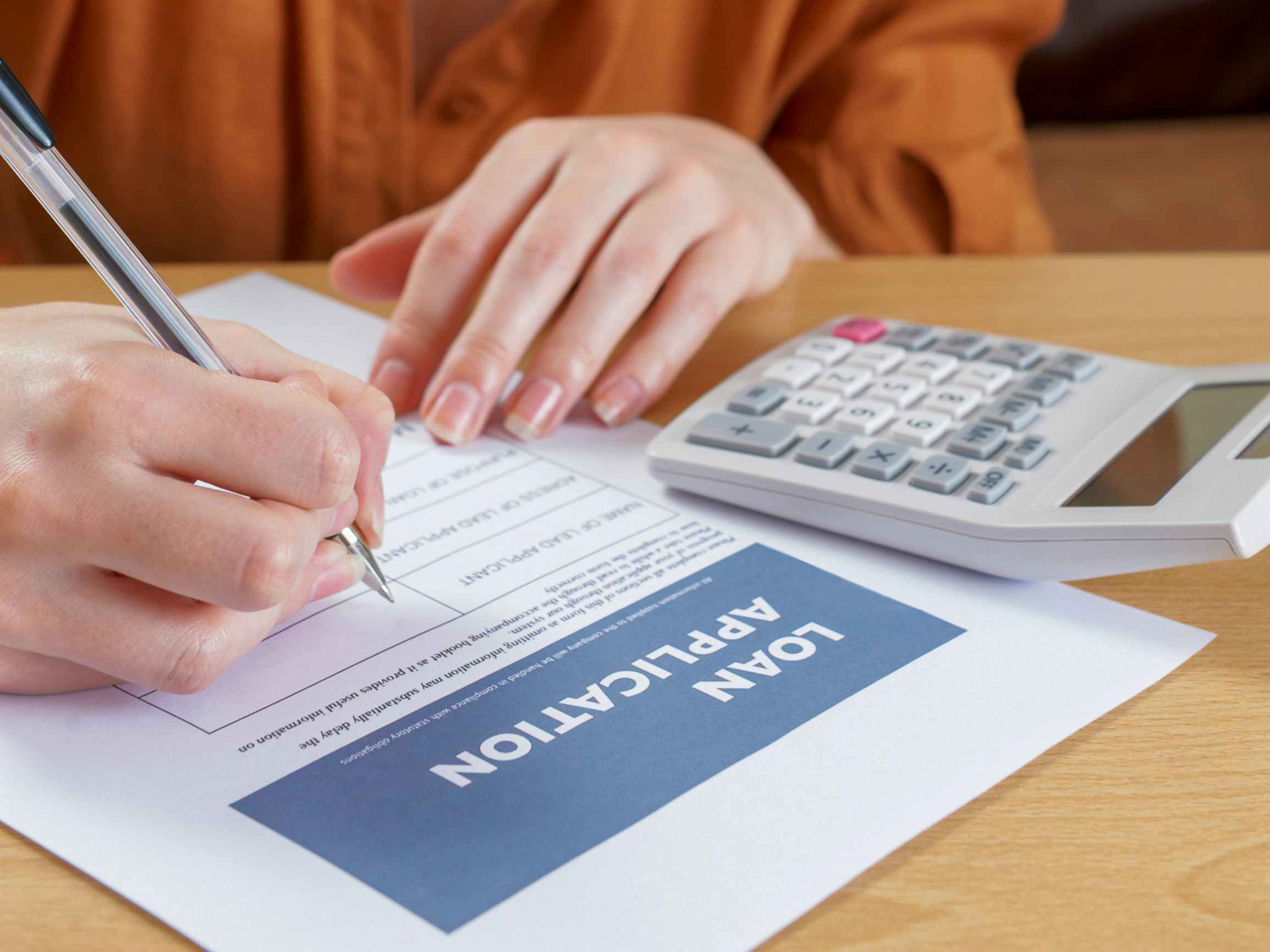 A person filling out a loan application