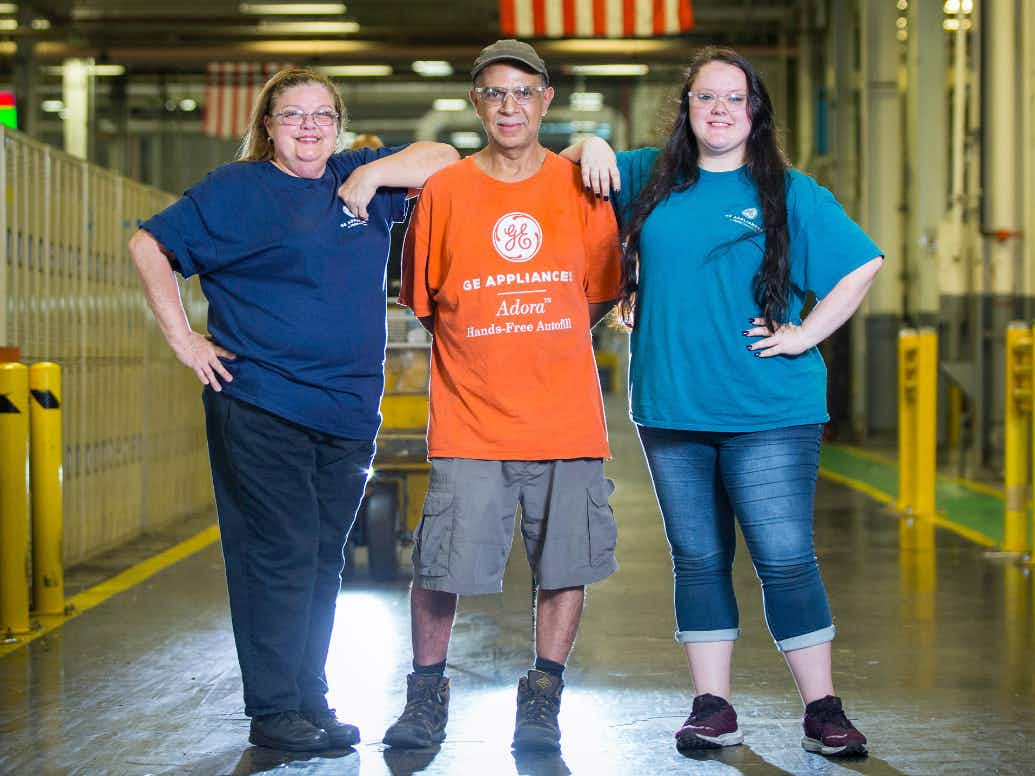 three ge appliances employees in factory