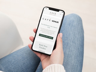 a person looking at the cafe appliances website on their iphone
