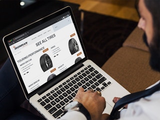 A person looking at the Ironman tires website