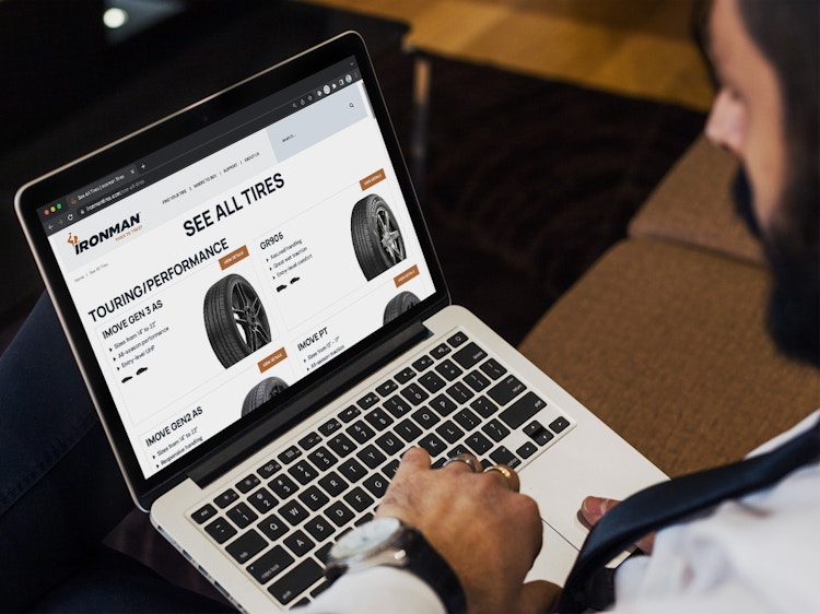 A person looking at the Ironman tires website