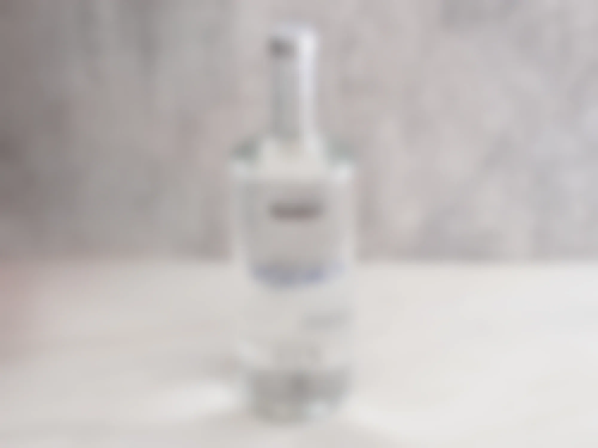 A bottle of Kirkland Vodka on a table