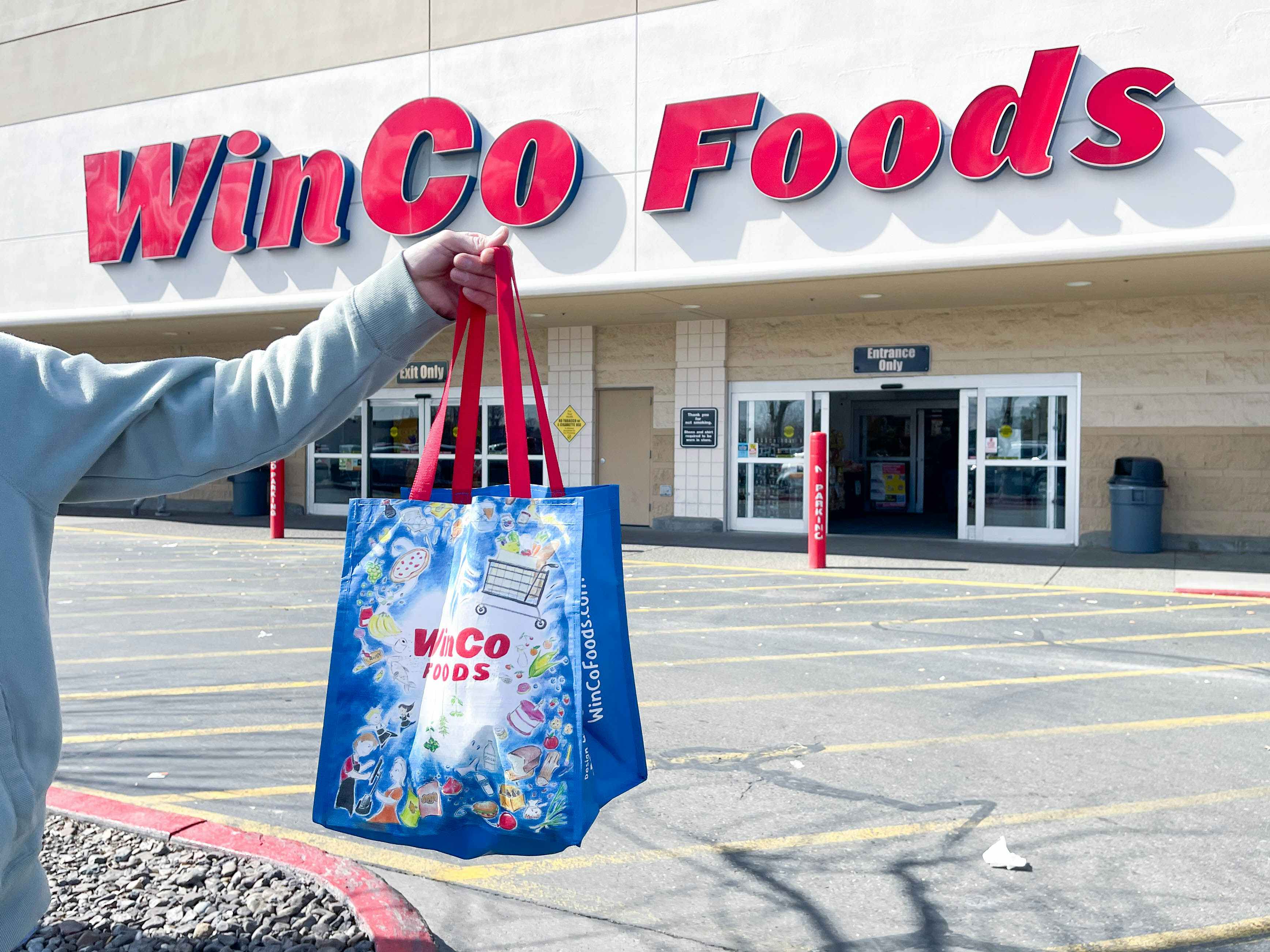 winco reusable shopping bag being held up