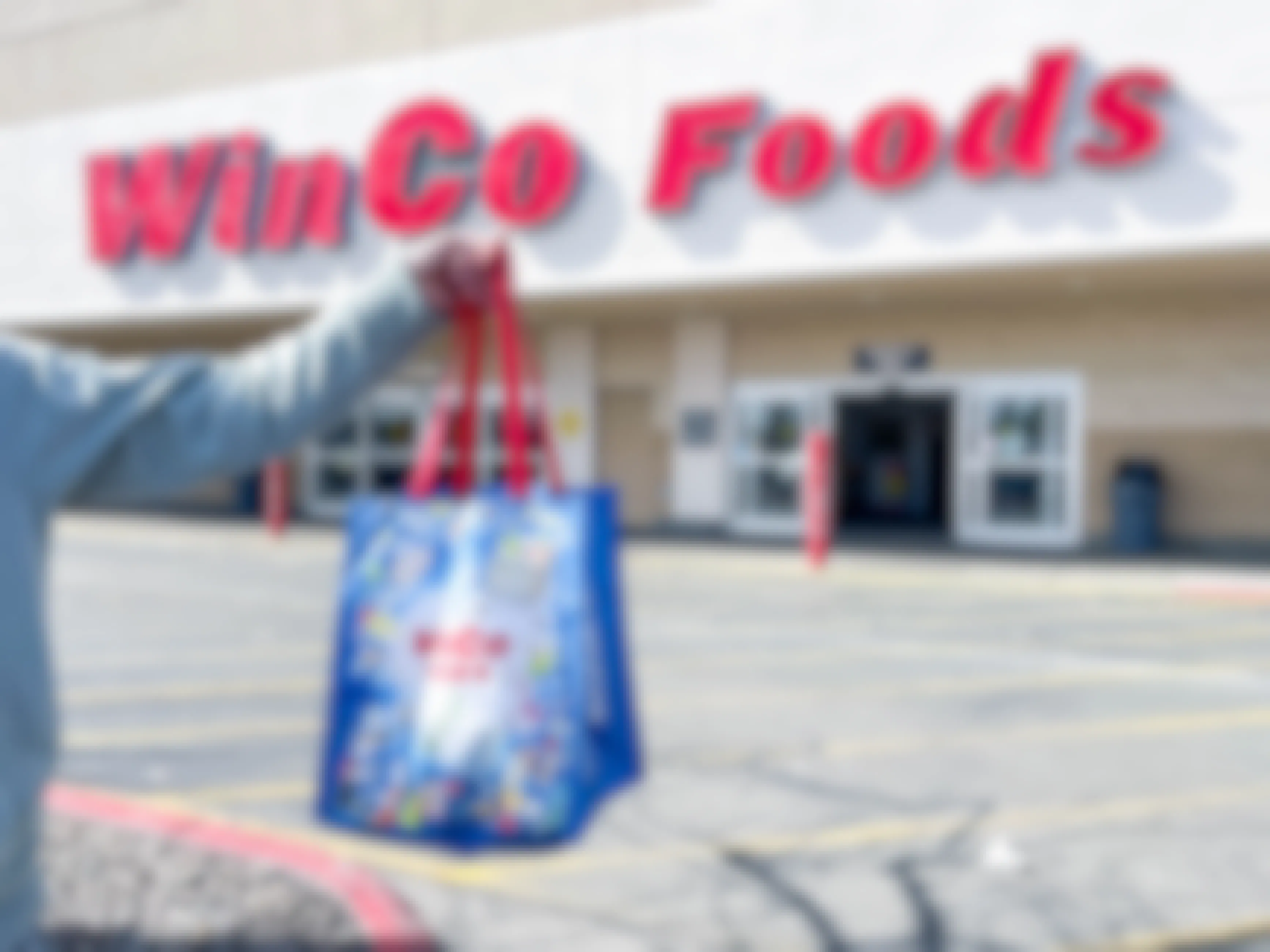 winco reusable shopping bag being held up