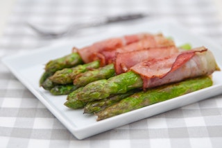 bacon wrapped asparagus on a plate 