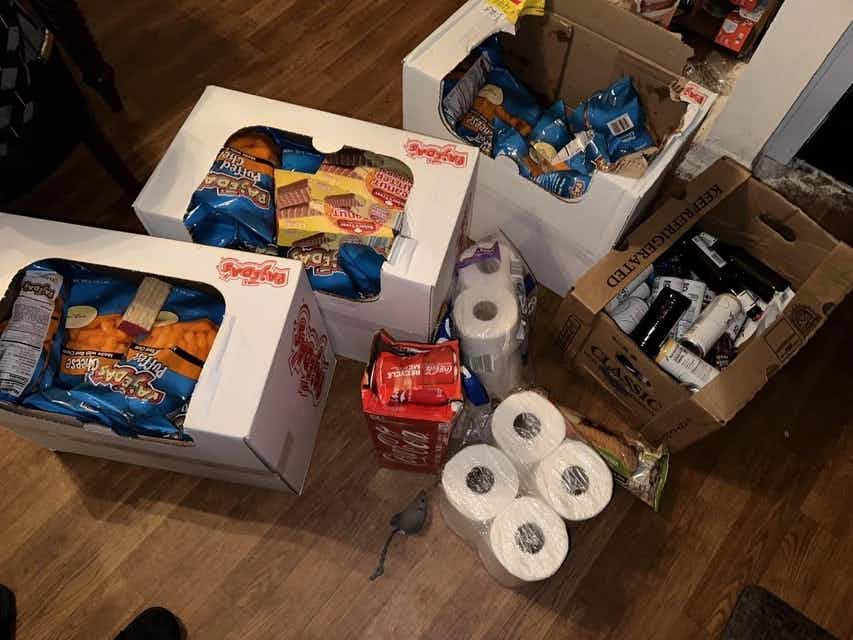 Boxes of products retrieved from an Aldi dumpster
